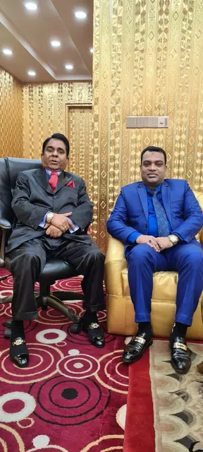 Abdul Kader Chowdhury at a formal meeting