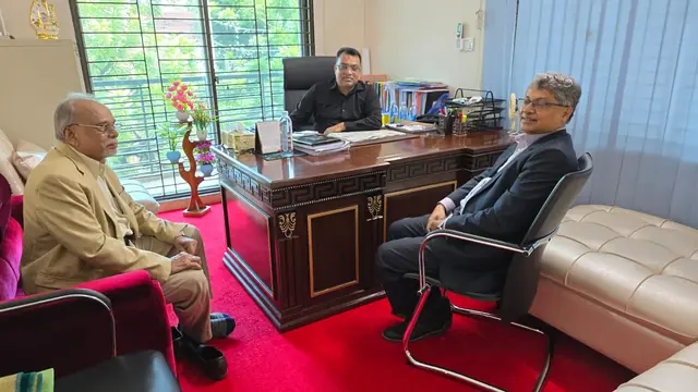 Abdul Kader Chowdhury in a meeting with guests at the office